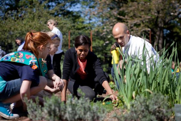 First Lady Michelle Obama and Sam Kass, Senior Policy Advisor for Healthy Food Initiatives, join students for the spring White House Kitchen Garden planting on the South Grounds