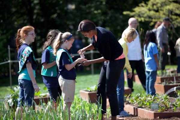 First Lady Michelle Obama gives seeds to girls from Girl Scout Troop 60325 in Fairport, N.Y. in the White House Kitchen Garden First Lady Michelle Obama gives seeds to girls from Girl Scout Troop 60325 in Fairport, N.Y. in the White House Kitchen Garden