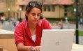 Description: A student using her laptop on the Stanford University campus in Palo Alto, California.  (PRNewsFoto/Apple/Court Mast) © AP Image