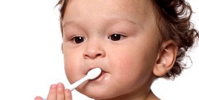 baby boy toothbrush in mouth