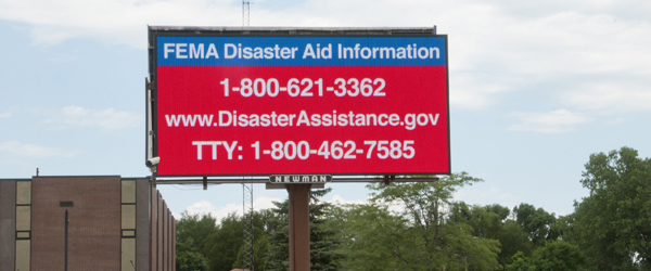 View of a FEMA large bilboard with web site and phone numbers