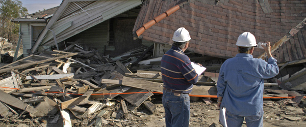 Building inspectors evaluate damaged homes after a disaster. 
