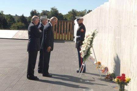 Vice President Joe Biden and Secretary Salazar stand before a wreath laying at the Wall of Names during the annual September 11th observance.