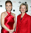Sarah Ferguson, Duchess of York wearing a satin halter red dress poses with Elizabeth G. Nabel, M.D. who is wearing a red skirt suite backstage at The Heart Truth's 2005 Red Dress Collection Fashion Show.