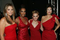 Daisy Fuentes, Vivica A. Fox, Hilary Duff, and Lynda Carter wearing designer red dresses pose for a picture at the conclusion of The Heart Truth's 2009 Fashion Show