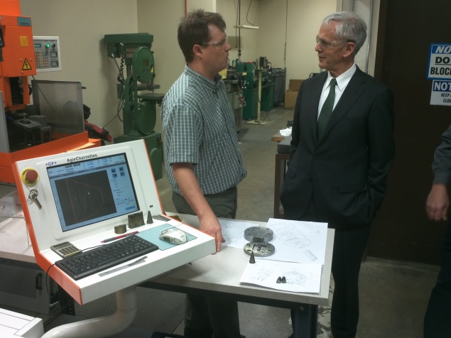 Secretary Bryson stops to speak with a computer operator at Schlegel Systems, Inc.