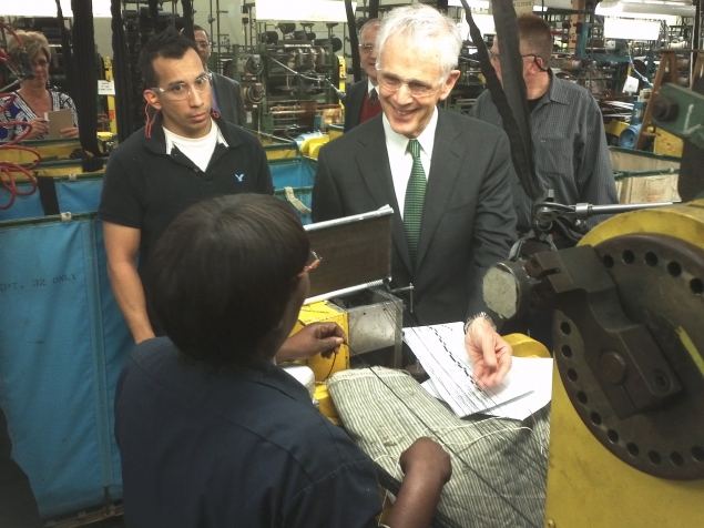 Secretary Bryson chats with a worker at Schlegel Systems, Inc.