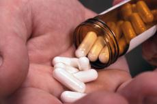 Photograph of pills in a hand