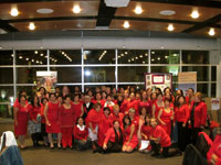 A group of women in red take a picture during the From Heart to Heart event organized by Champions in Washington DC.