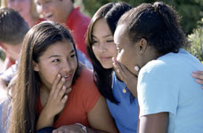 Photo of teens gossiping