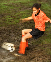 teen girl playing soccer