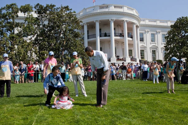 President Barack Obama cheers on kids taking part in the Easter Egg Roll on the South Lawn of the White House