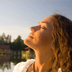 Photo of woman taking a deep breath.