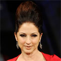 Gloria Estefan wears a red dress at New York Fashion Week 2012