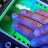 Hands being fingerprinted to enforce immigration law. 