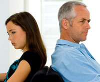 Daughter and father ignoring each other