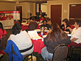 In Oklahoma City, Oklahoma, 13 women are sitting in a Champions training class.