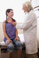 girl being examined by a doctor