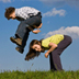 Photo of a boy and a girl playing leap frog.
