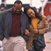 Photo of an African-American couple walking together.