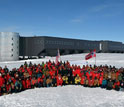 Norwegian Prime Minister Jens Stoltenberg and personnel at the geographic South Pole.