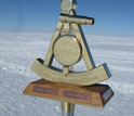 Image of the 2011 bronze marker at NSF's Amundsen-Scott South Pole Station.