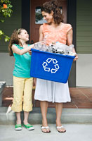Mother and daughter recycling