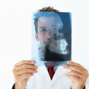 Health care professional looks at X-ray