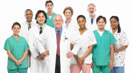 Team of doctors, nurses and surgeons standing on white background, portrait.