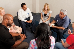 group of people in a circle talking