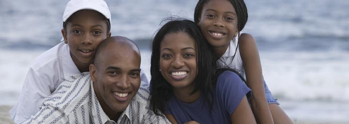 Portrait of smiling family on the beach