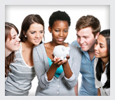 A group of youth looking at a piggy bank