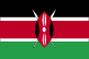 Flag of Kenya is three equal horizontal bands of black at top, red, and green; red band is edged in white; large warriors shield covering crossed spears is superimposed at center. 2004.