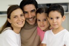 Photograph of a woman, man, girl and boy