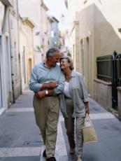 Photograph of a man and a woman walking