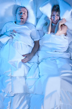 Man Snoring and Woman Not Able to Sleep