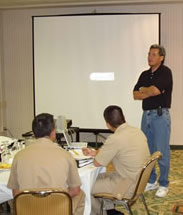 Speaker presenting to group of employees. Photo Courtesy of the Indian Health Service/U.S. Department of Health and Human Services.