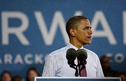 Barack Obama addresses supporters during a rainstorm in Milwaukee.