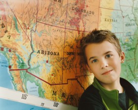 Boy next to map of states