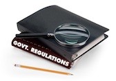 Magnifying glass on top of government regulations