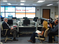 Ken Murphy, Region X administrator, pre-tapes an interview for the upcoming Nov. 9 National Emergency Alert System Test, with Seattle FOX TV Affiliate KCPQ-13 journalist Parella Lewis and photojournalist Walker Anderson. The interview took place in the Regional Response Coordination Center, Bothell, Wash. FEMA Newsphoto//Mike Howard 