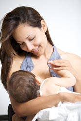 A woman breastfeeds her child.