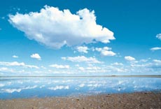 A blue sky with fluffy clouds