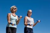 Two women work out together