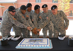 Soldiers cutting a cake