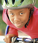 Photo: boy riding bike with helmet