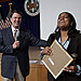 May Newsletter 10 - Michelle Beal, Retirement Services, accepts award for Most Informative Table at the OPM Block Party.