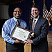 May Newsletter 8 - Rafiell Jones of Employee Services accepts award for Most Creative Table at the OPM Block Party.