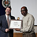 May Newsletter 9 - Richard Murray of Internal Oversight and Compliance accepts award for Friendlist Table for the OPM Block Party.