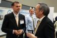 William Parish from Solar Mosaic, one of nine solar startups chosen for the latest round of SunShot Incubator funding, discusses his company’s project with Energy Secretary Steven Chu at the SunShot Grand Challenge Summit in Denver, Colorado. | Photo by John De La Rosa.